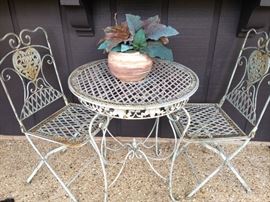Patio table and folding iron chairs
