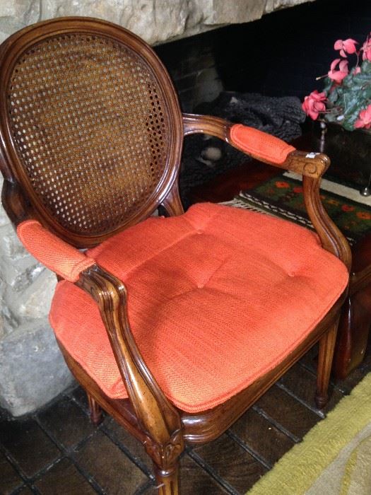 One of two cane armchairs (The chairs would be perfect as host chairs at your dining table.)
