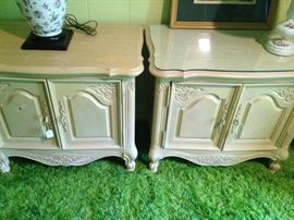 Two yellow nightstands (1 has custom shaped glass on the top)