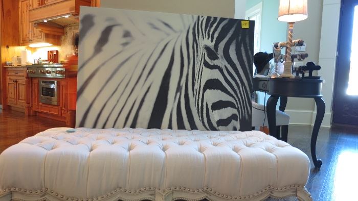 Zebra wall-art, tufted white bench seat 