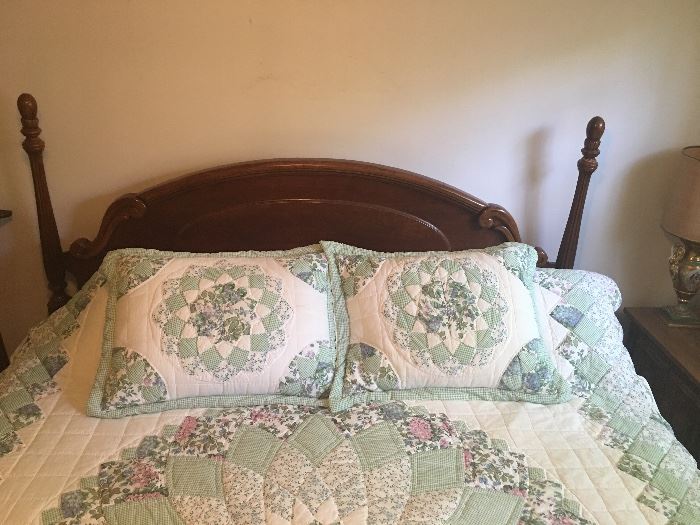 King size solid wood headboard and an amazing quilt. 