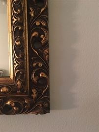 Close up of the detailed mirror frame