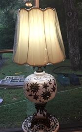 White tall lamp with gold gild flowers with a silk shade