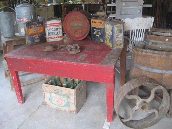 oil cans, soda crate, wooden barrel