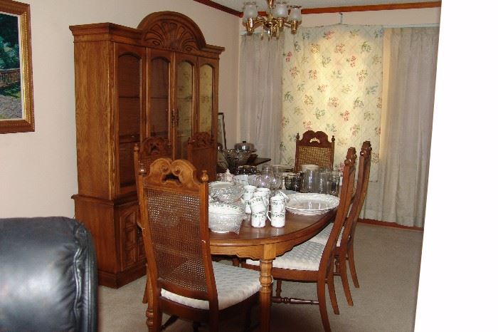 Late 60's- Early 70's table , china cabinet, and chairs.. Very nice..