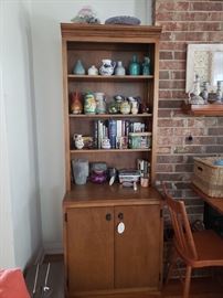 Two matching curio/bookshelf units. Only one shown in above photo.