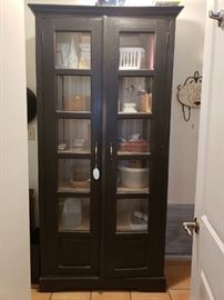 Freestanding kitchen cupboard with glass front doors