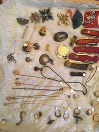 Costume jewelry and pocket knives (several Swiss Army knives)