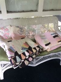 Several vintage and antique handmade quilts