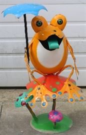 Metal frog on mushroom