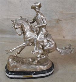 Unusual finish cowboy statue