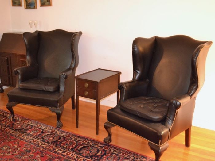 Pair of black leather wing back chairs