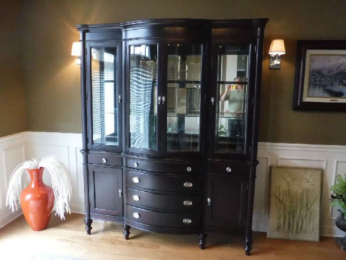 Touch-light china cabinet. It does come apart and the bottom can be a buffet and the top part with legs or a platform added can become a stylish display case.