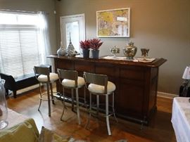 This bar is not anchored to the floor. It however can be and does have a sink that may be adapted to plumbing? The small fridge inside of it was added later and is not part of the sale.