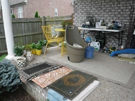 A few scatter rugs and some outdoor equipment.