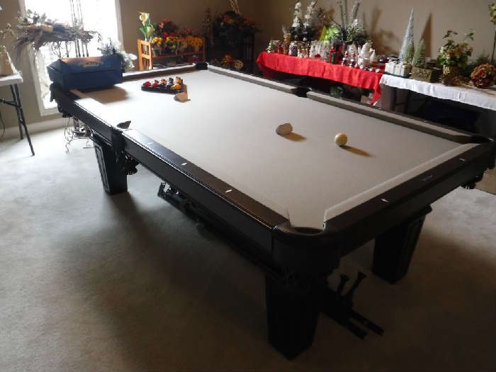 Truly a "like new" pool table only played on less than 10 times. It's sleek non-fussy design is perfect for the contemporary home. It will come complete with the cues/cue stand/accessories as well as a never used table cover that cost in excess of $100.