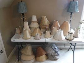 We have a lot of different lamp shades that are being sold separately from the lamps and prices vary by size. The 2 rear lamps are priced as a unit and sold with shades.