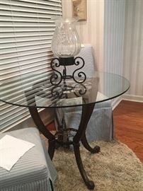 Iron & Glass Bistro Table Base Can Be Used for Umbrella. Round Shag Rug. Chairs are undecided. 