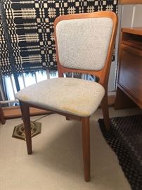 The second of two Danish Modern upholstered teak dining/office chairs.  This one is in need of reupholstry 