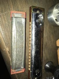 two vintage harmonicas -- a "My Friend" and a "World Star"