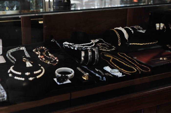 Collection of Designer Costume Jewelry Including Crystal, Pearl, and Gold Necklaces & Bracelets. 
