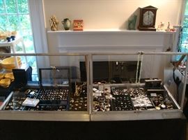 Entire Case on left is Gold 14K, 18K, & 10K                                             
                                                                                                                  
Entire Case on Right Is Sterling Jewelry
