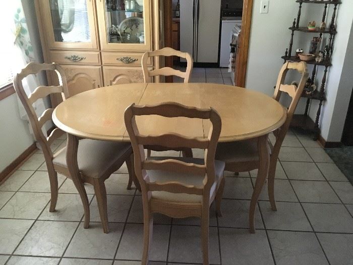 If you like lighter wood, this table and chairs with matching china cabinet is a great set.