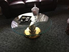 A contemporary glass coffee table.