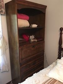 This is a combination bookshelf/desk unit.