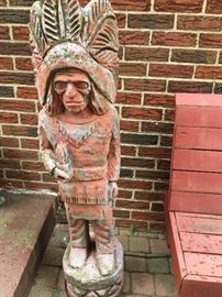 A cement "cigar-store Indian."