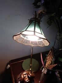 Lamp with glass shade.