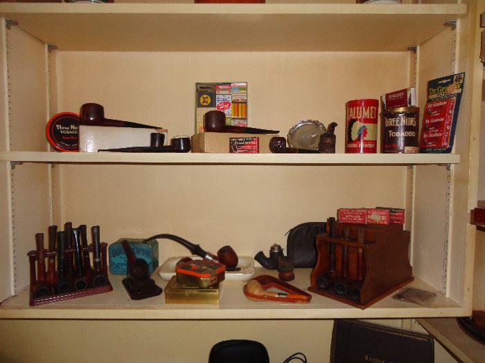 Collection of pipes and tobacco items