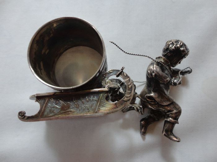 Plated silver table napkin holder, complete with little boy who needs re-attaching