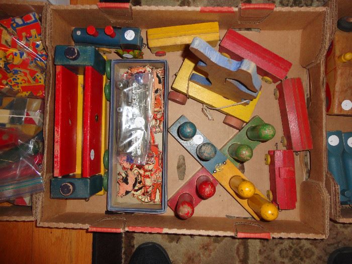 We have three boxes of wooden toys, some complete and some with pieces missing - great selection