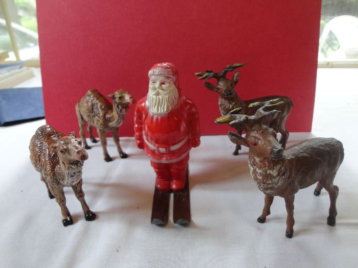 Metal reindeer and camels from German Christmas collection with plastic Santa on metal skis