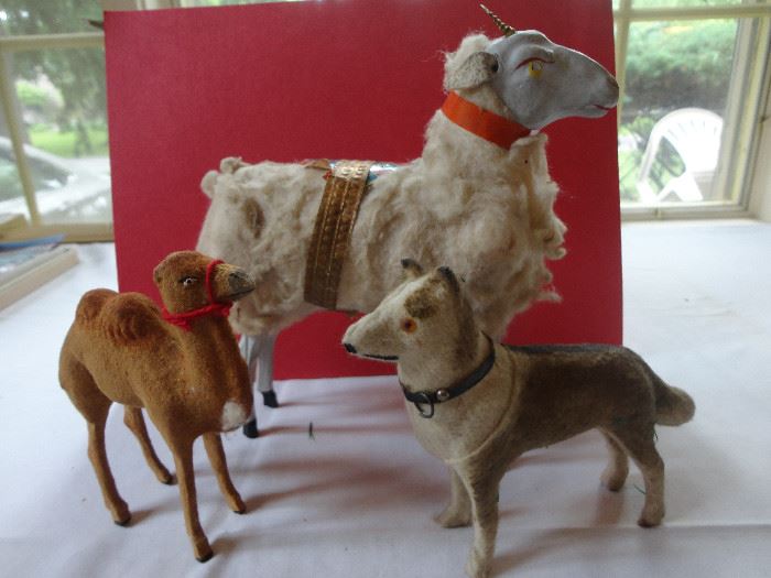 Trio of German Christmas figurines - dog and camel are in good condition but large ram needs some help - missing one gilded horn