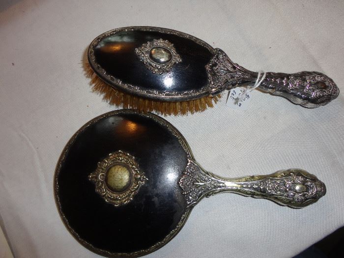 Silver plated Victorian/Edwardian hairbrush and mirror - mirror beveled and in very good condition.  Early 1900's