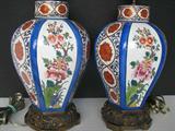 Pair of Parisian hand painted porcelain lamps, with harps, shades and finials;      10" tall