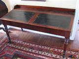 Slant Front, Double Clerks Desk, circa 1850, with original leather surface and turned legs;  front height 28 1/2", back height 34 1/2", width 62 3/4"