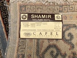 Tag for rug with blue center.