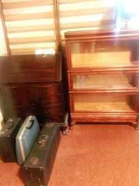 vintage serpentine drop front desk, barrister bookcase, vintage typewriters and vintage saxophone