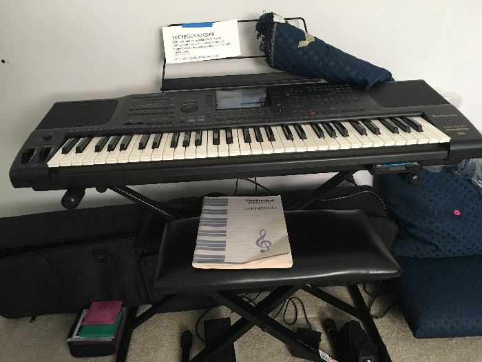 Technics KN 2000 digital keyboard. Internal recording, plus floppy disc recording, with extras, including programmable foot pedals.  Complete with stand, and folding bench,