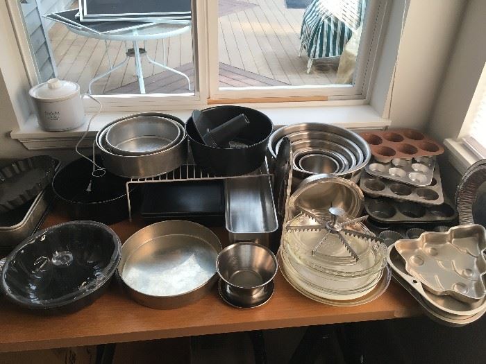 Kitchen: muffin tins, cake pans, pie plates, bunt pan, angel food cake pan and loaf pan, mixing bowls, flan pan, spring form pans, small crock pot, covered 9x13 baking pan.