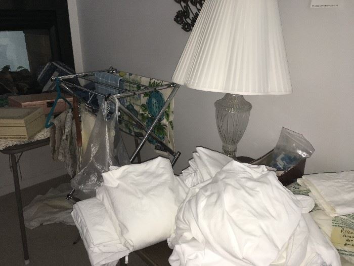 Oops.  These sheets haven't been sorted yet.  Sheets and pillow cases, Lamp, kitchen towels, jewelry cases (old). Linens.