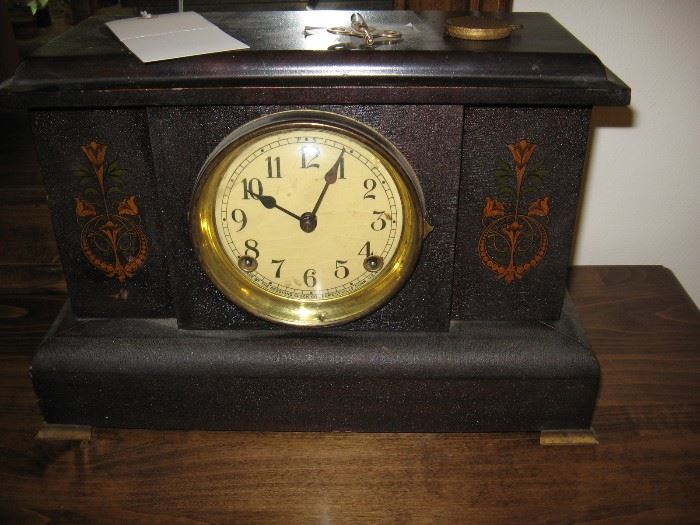 Antique seven day clock with winding keys.
