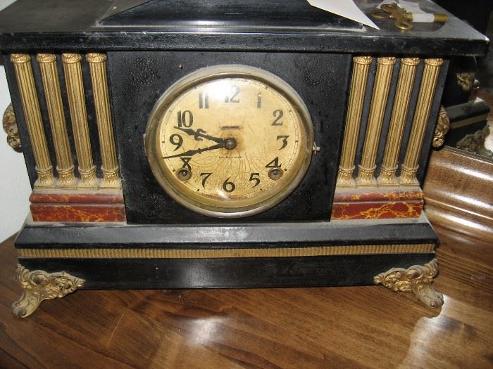Antique mantel clock with winding keys.