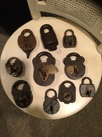 Collection of antique locks with keys. Among them are a  Scandinavian prison lock, V. R. Padlock...1800s,         W. Bohanan Railroad grade 1879...I & MRT. Co.
