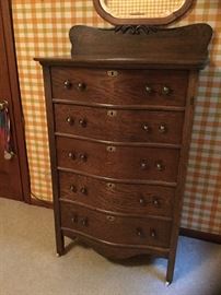 Dark oak curved front chest of drawers