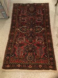 Antique Oriental rug. 56-inches  by 32-inches