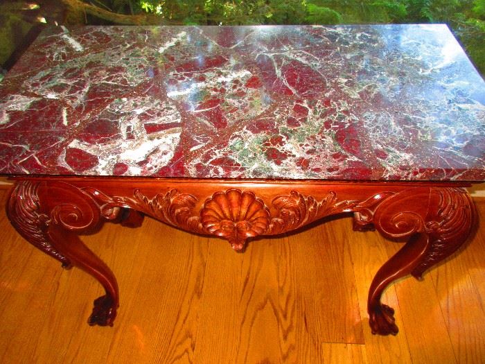 Shell-motif marble-top table with claw and ball feet